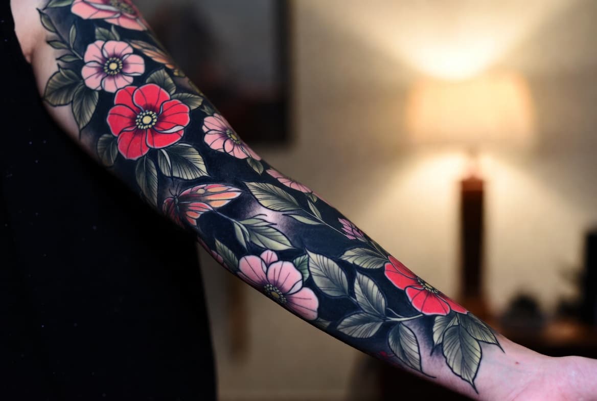 Neo-traditional floral sleeve by Riven Cole